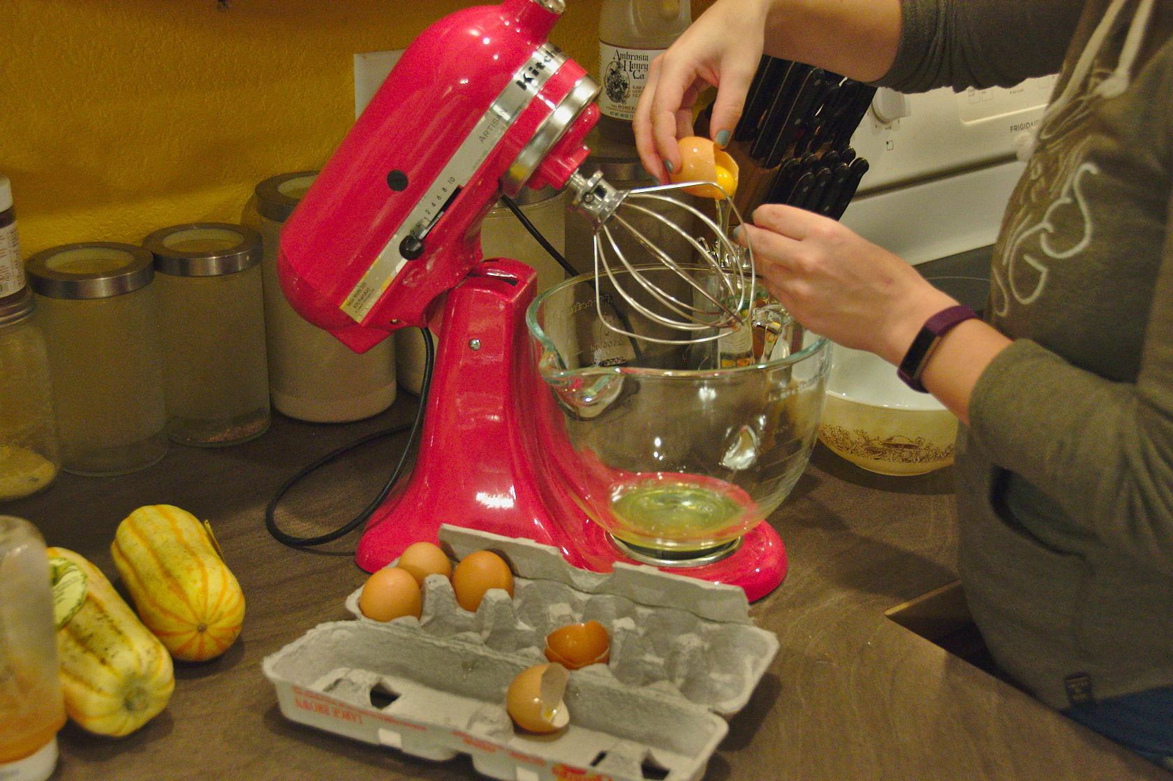 Pouring egg whites in a mixing bowl